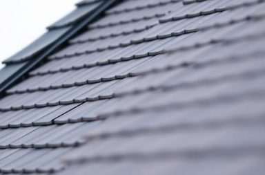 Close-up of a steeply pitched roof structure.